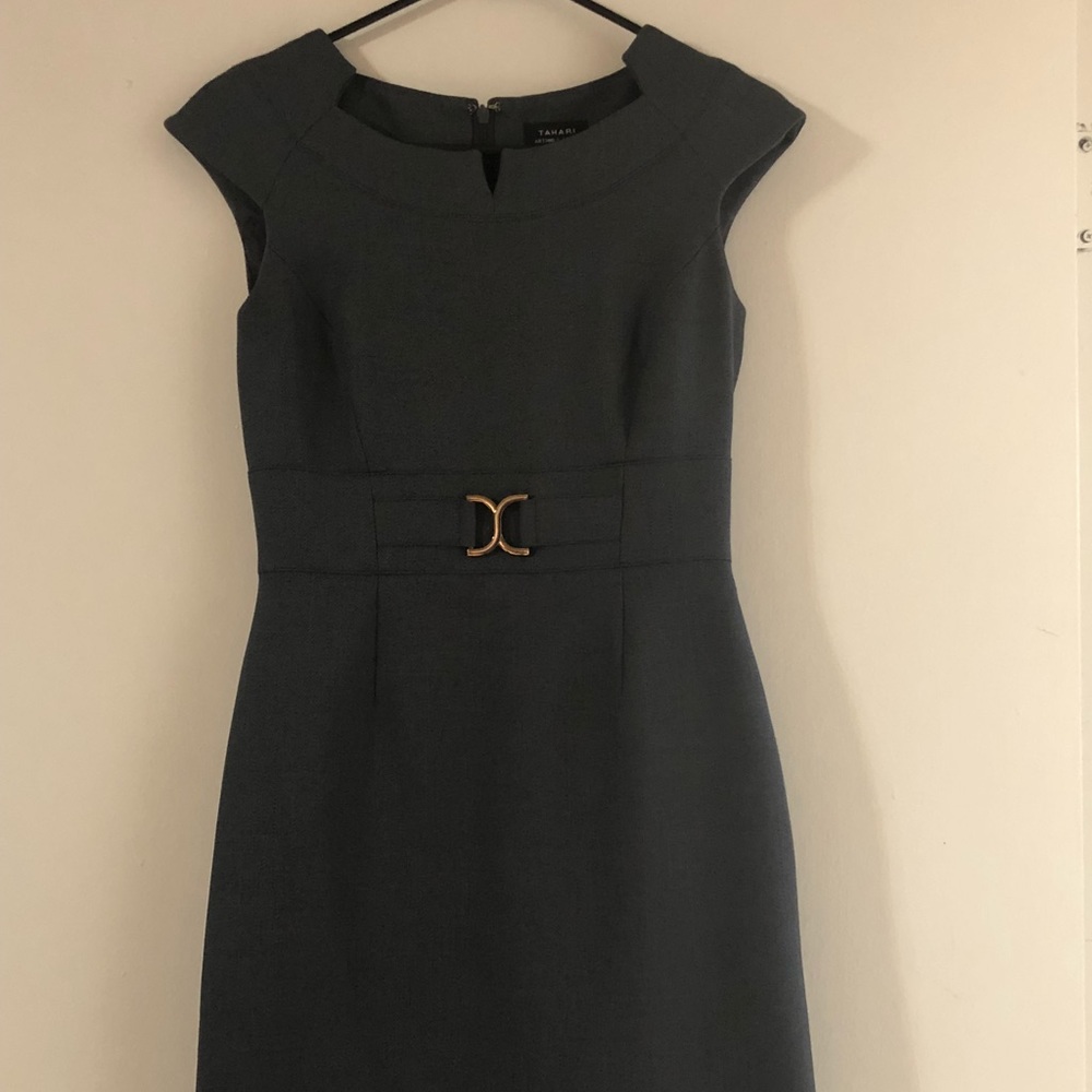 Almost new. The dress has a nice gray color.